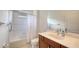 Bathroom featuring a shower-tub combo, a white shower curtain, and a wood vanity at 7158 Westhill Ct, Lakewood Ranch, FL 34202
