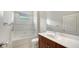 Bathroom featuring a shower-tub combo, a white shower curtain, and a wood vanity at 7158 Westhill Ct, Lakewood Ranch, FL 34202