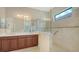 Primary bathroom with double sink vanity and a glass enclosed tiled shower at 7158 Westhill Ct, Lakewood Ranch, FL 34202