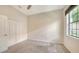 Neutral bedroom features carpet, closet, a ceiling fan, and natural light at 7158 Westhill Ct, Lakewood Ranch, FL 34202