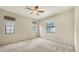 The light-filled bedroom boasts neutral walls and carpeting with a window overlooking a lush landscape at 7158 Westhill Ct, Lakewood Ranch, FL 34202