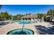 Resort-style community pool with lounge chairs and umbrellas for relaxation at 7158 Westhill Ct, Lakewood Ranch, FL 34202