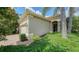 Charming home featuring a two-car garage, brick paved driveway, and well-maintained landscaping at 7158 Westhill Ct, Lakewood Ranch, FL 34202