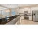 Modern kitchen with stainless steel appliances, granite countertops, and pendant lighting at 7158 Westhill Ct, Lakewood Ranch, FL 34202