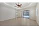 Spacious living room with sliding glass doors leading to a pool area at 7158 Westhill Ct, Lakewood Ranch, FL 34202