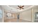 Open concept living area with breakfast bar, tile floors, and modern lighting at 7158 Westhill Ct, Lakewood Ranch, FL 34202