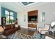 Open living room with modern decor, comfortable seating, and large TV for relaxing gatherings at 7158 Westhill Ct, Lakewood Ranch, FL 34202