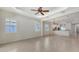 Bright living room with tile floors and an open layout to the kitchen at 7158 Westhill Ct, Lakewood Ranch, FL 34202