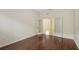 Home office with hardwood floors, desk, shelves, and bright window light at 7158 Westhill Ct, Lakewood Ranch, FL 34202