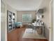 Home office features hardwood floors, built-in shelving, bright natural light and soothing colors at 7158 Westhill Ct, Lakewood Ranch, FL 34202