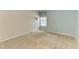 Carpeted bedroom features a double window, ample lighting, and neutral paint at 7576 Plantation Cir, Bradenton, FL 34201
