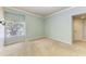 Bright and airy bedroom includes carpet floors, neutral walls, window and closet at 7576 Plantation Cir, Bradenton, FL 34201