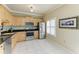 Well-equipped kitchen featuring stainless steel appliances, wood cabinets, and tile flooring at 7576 Plantation Cir, Bradenton, FL 34201