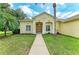 Charming home with a well-manicured lawn and inviting front entrance at 8136 Snowy Egret Pl, Bradenton, FL 34202