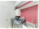 Well-equipped laundry room with a modern washer and dryer, a stainless steel sink, and storage cabinet at 8136 Snowy Egret Pl, Bradenton, FL 34202