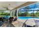 Stunning screened pool area with stylish outdoor seating, perfect for relaxation and entertaining with beautiful backyard views at 8136 Snowy Egret Pl, Bradenton, FL 34202