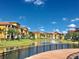 Scenic view of the lake and fountains in front of the beautiful condominium buildings at 8325 38Th Street E Cir # 107, Sarasota, FL 34243