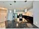 A modern kitchen featuring stainless appliances, granite counters, and stylish pendant lighting at 8325 38Th Street E Cir # 107, Sarasota, FL 34243