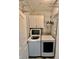 Laundry room with modern washer and dryer set at 8325 38Th Street E Cir # 107, Sarasota, FL 34243