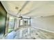 Living room featuring stylish floors, modern lighting, a ceiling fan, and an outdoor view at 8325 38Th Street E Cir # 107, Sarasota, FL 34243