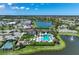 Breathtaking aerial view showcasing community pool, lake, and recreation facilities at 8936 Artisan Way, Sarasota, FL 34240