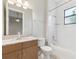 Neutral bathroom featuring marble countertops, modern fixtures and a shower-tub combination at 8936 Artisan Way, Sarasota, FL 34240