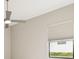 Bedroom featuring a ceiling fan, neutral colored wall, and a window with blinds at 8936 Artisan Way, Sarasota, FL 34240