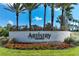 Community entrance sign, Artistry Sarasota, with well-maintained landscaping and flowering shrubs at 8936 Artisan Way, Sarasota, FL 34240