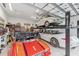 This spacious three-car garage includes car lifts, ample storage, and is ready for any car enthusiast at 8936 Artisan Way, Sarasota, FL 34240