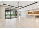 A spacious room with tile flooring and natural light overlooks the pool at 8936 Artisan Way, Sarasota, FL 34240