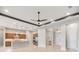Bright, open-concept living area with neutral walls and ceilings that feature designer lighting at 8936 Artisan Way, Sarasota, FL 34240