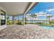 Lanai featuring an inground pool, a water view, and stone pavers at 8936 Artisan Way, Sarasota, FL 34240