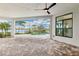Lanai featuring an inground pool, water view, and beautiful stone pavers at 8936 Artisan Way, Sarasota, FL 34240