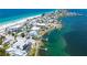 Stunning aerial view of a beachfront property with a private pool, docks, and easy access to the beach at 901 Gulf S Dr # 14, Bradenton Beach, FL 34217