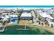 Aerial view of beachfront condos with docks, swimming pool, and waterfront access at 901 Gulf S Dr # 14, Bradenton Beach, FL 34217