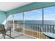 Enjoy breathtaking water views from this serene screened balcony with comfortable seating at 901 Gulf S Dr # 14, Bradenton Beach, FL 34217