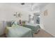 Bright bedroom with two twin beds and a balcony overlooking the community at 901 Gulf S Dr # 14, Bradenton Beach, FL 34217