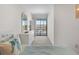 Bright bedroom with a dresser and balcony overlooking the community at 901 Gulf S Dr # 14, Bradenton Beach, FL 34217