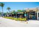 Charming restaurant and bar with outdoor seating and tropical landscaping, offering a lively atmosphere at 901 Gulf S Dr # 14, Bradenton Beach, FL 34217