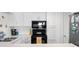 This stylish kitchen offers stainless appliances, white cabinets, and stone counters at 901 Gulf S Dr # 14, Bradenton Beach, FL 34217