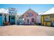 Shops with colorful storefronts, including a bar, pier, and boat tours at 901 Gulf S Dr # 14, Bradenton Beach, FL 34217
