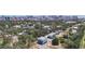 Picturesque aerial shot featuring modern homes nestled among trees with a stunning cityscape backdrop at 941 N Osprey Ave, Sarasota, FL 34236
