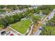 Aerial view shows a recreation area with a park, picnic tables, a basketball court, and vehicle parking at 941 N Osprey Ave, Sarasota, FL 34236