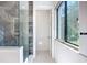 Bathroom showcasing a glass-enclosed shower with marble tile at 941 N Osprey Ave, Sarasota, FL 34236