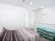 Bright modern bedroom with a closet, interior door, and accent lighting at 941 N Osprey Ave, Sarasota, FL 34236