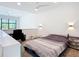 Modern bedroom with desk and exterior view from the staircase landing at 941 N Osprey Ave, Sarasota, FL 34236