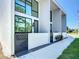Modern townhome showcasing a clean facade, large windows, and inviting walkway at 941 N Osprey Ave, Sarasota, FL 34236