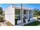 Modern townhome displaying sleek design, large windows, and inviting curb appeal at 941 N Osprey Ave, Sarasota, FL 34236