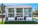 Modern townhome showcasing sleek architecture, large windows, and inviting private entrances at 941 N Osprey Ave, Sarasota, FL 34236