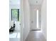 Hallway with view into bright room with large windows and natural light at 941 N Osprey Ave, Sarasota, FL 34236